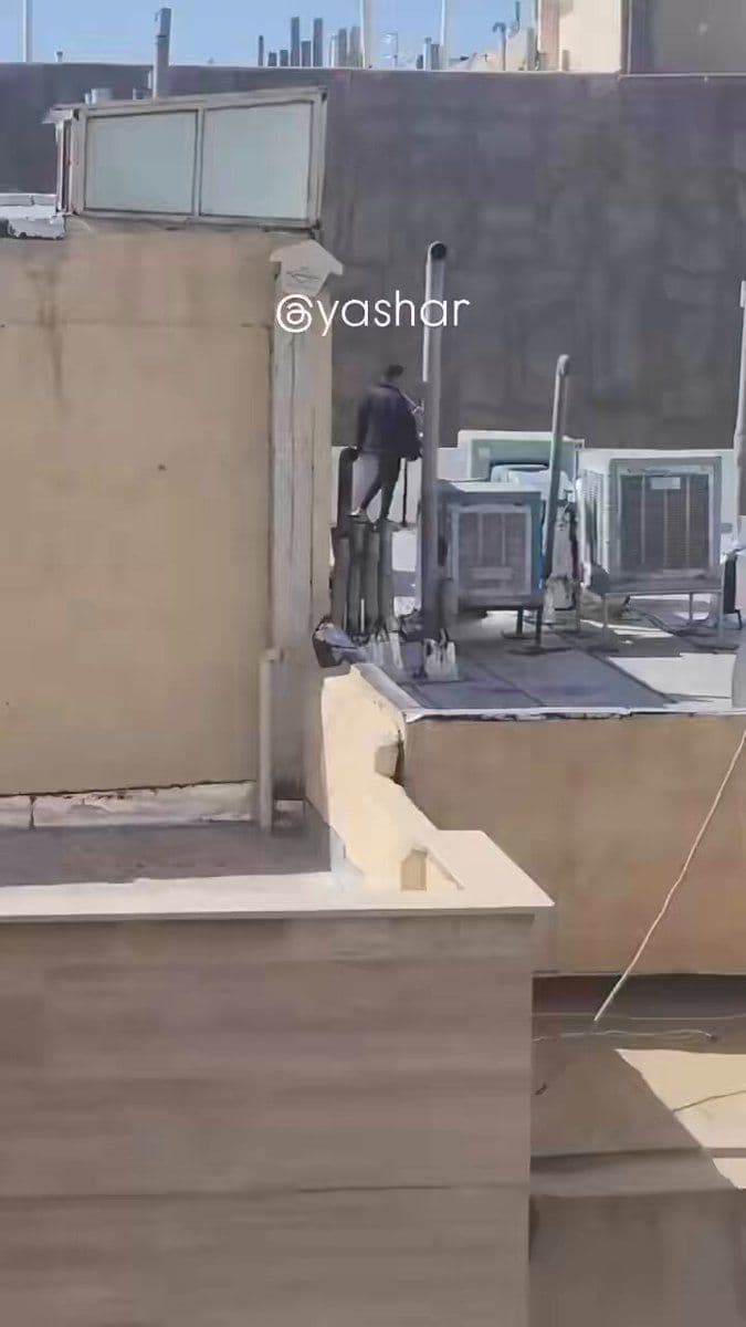 @Goldie Ghamari | گلسا قمری 🇮🇷: An Iranian man is casually smoking a hookah while standing on his rooftop watching the United States and Israel destroy IRGC facilities in the city of Karaj.
This is peak Iranian. All he's missing ar