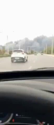 @Babak Taghvaee - The Crisis Watch: A massive airstrike struck an ammunition depot belonging to the IRGC Navy in the city of Bushehr in southwest Iran. In this footage recorded this evening, a large plume of smoke can be seen rising fro