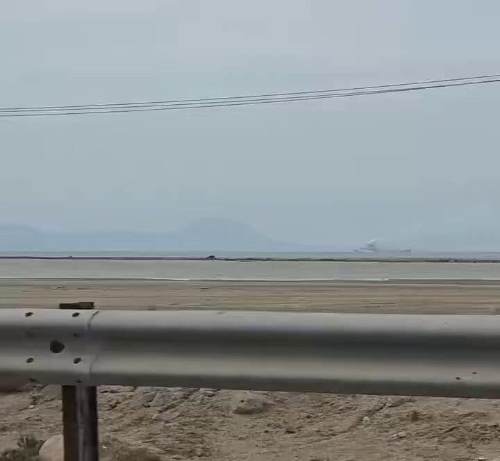 @Babak Taghvaee - The Crisis Watch: This video, recorded during the first day of the war, shows an Iranian Navy warship on fire near Qeshm Island in the Strait of Hormuz in southern Iran after being struck by the U.S. Navy during the fi