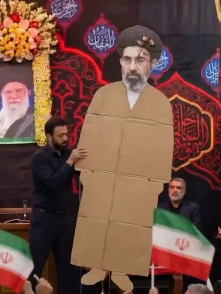 @Mahyar Tousi: Mojtaba Khamenei couldn’t turn up so they had to use his cardboard cutout.
Why is his head so big and why did they use a photo of him that looks so miserable? 😂
