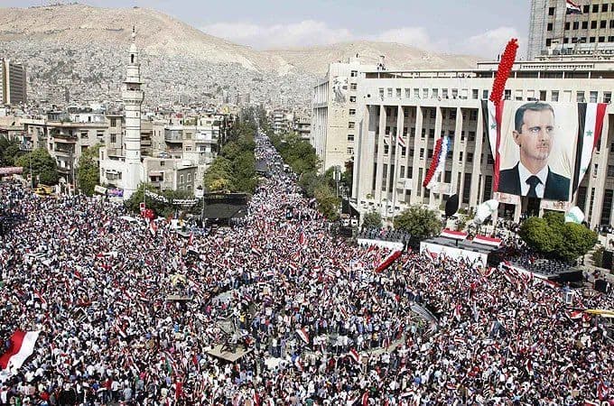 @Mahyar Tousi: Here is a huge pro-Assad rally in Syria before he ran away like a rat to Moscow.
Even he managed to get a bigger crowd than the IRGC in Iran. And he still lost like a bitch.