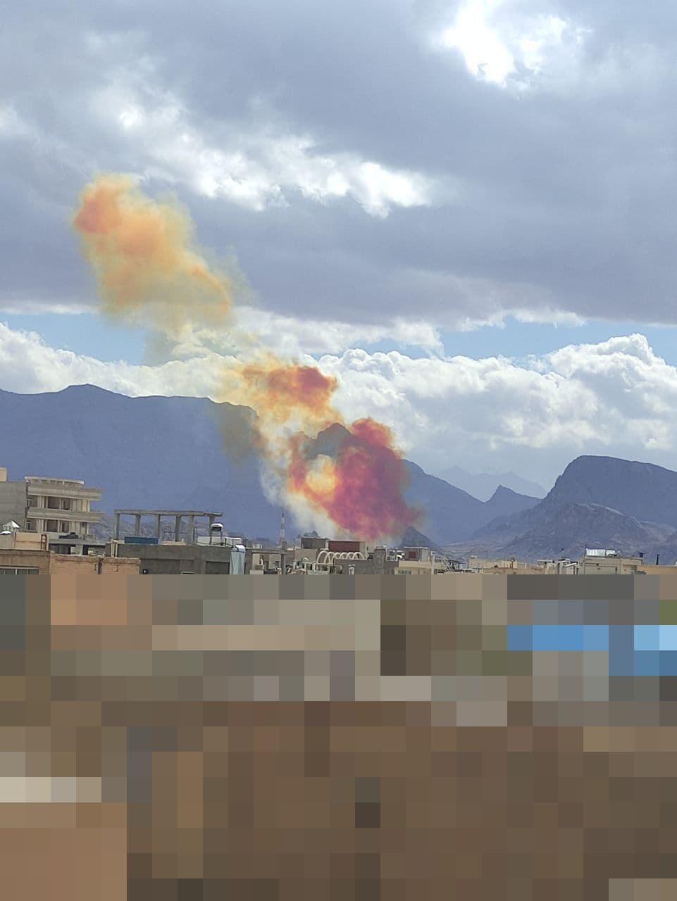 @Vahid Online: #Yazd around 14:20'
Images received of red and orange smoke
A citizen who sent a photo with the caption 'The moment a missile is launched from the IRGC missile base in the mountains behind Koohstan Pa