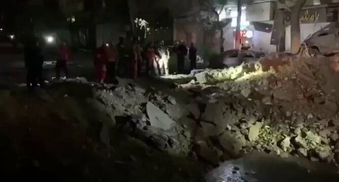 @Babak Taghvaee - The Crisis Watch: BREAKING: An image and a video show the crater from an impact on the road surface in North Sohrevardi Street (Palizi area), Tehran, the capital city of Iran, following the 21:10 strike on Saturday. Th