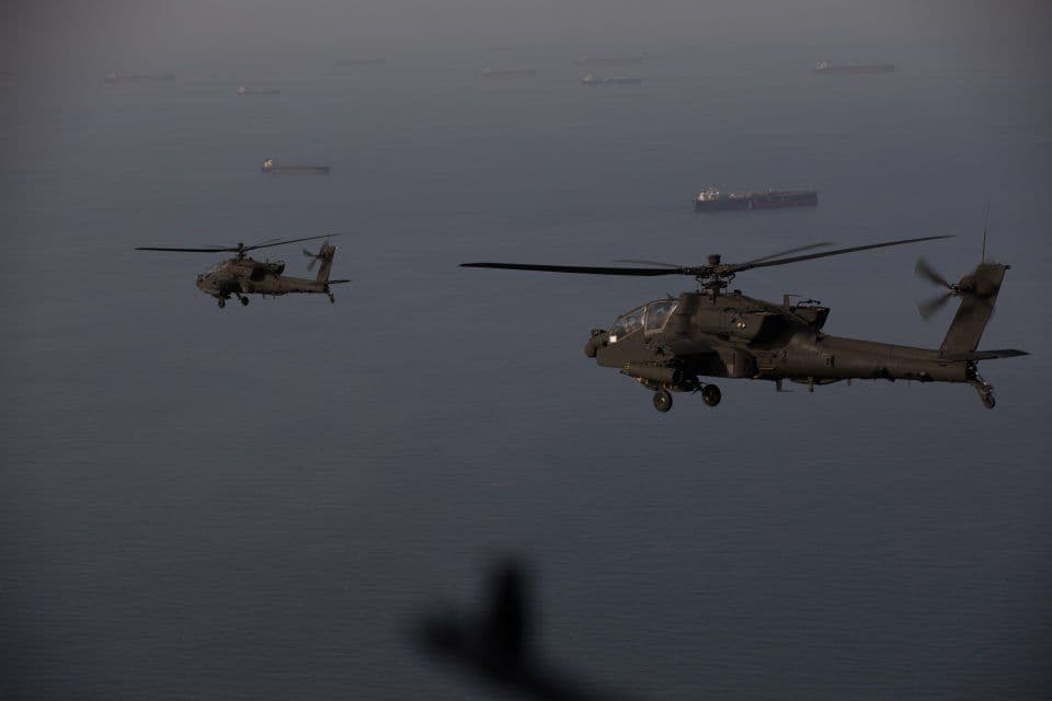 @Babak Taghvaee - The Crisis Watch: BREAKING: Images released by CENTCOM show U.S. Army AH-64E Guardian attack helicopters patrolling over the Strait of Hormuz alongside MH-60S and MH-60R helicopters of the U.S. Navy during the naval bl