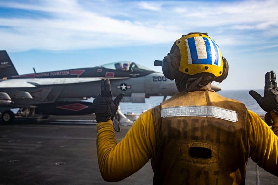 @Open Source Intel: U.S. Central Command (CENTCOM):
"A U.S. Sailor signals to an F/A-18E Super Hornet as it prepares to launch from the flight deck of USS Abraham Lincoln (CVN 72) during U.S. naval blockade operations i