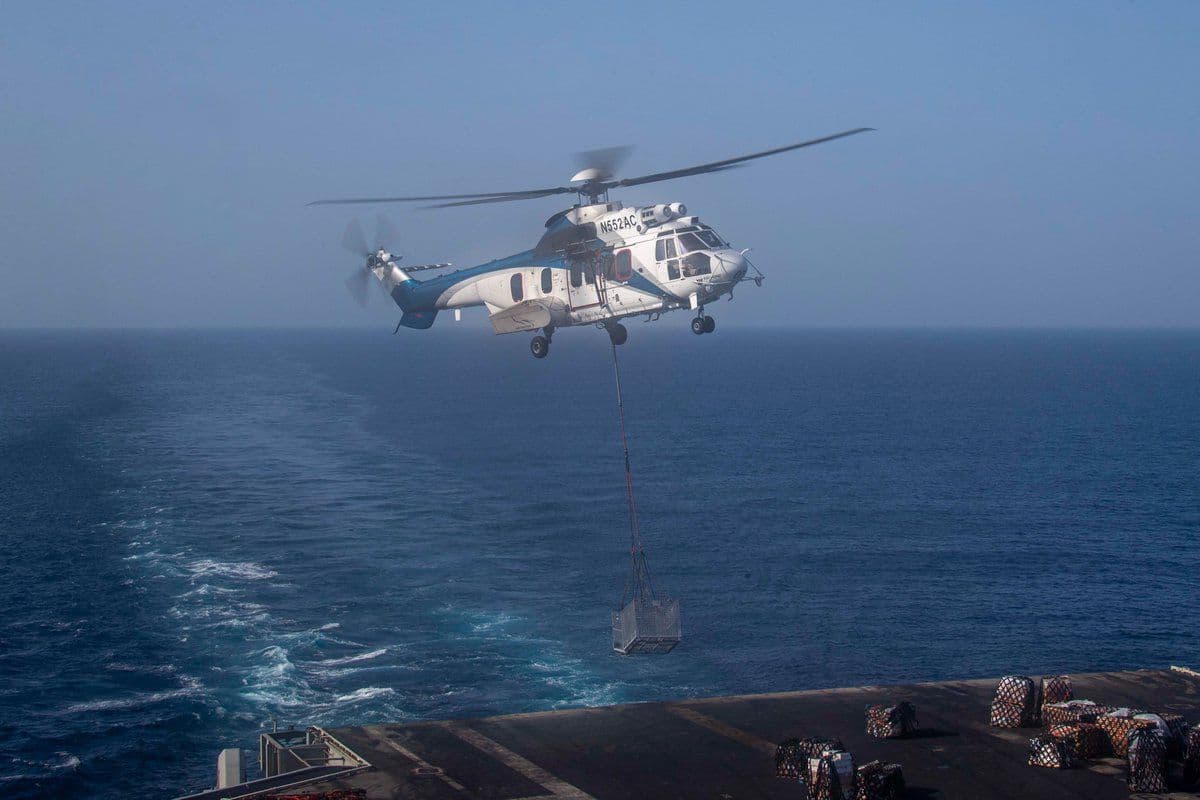 @U.S. Central Command: Aircraft carrier USS Abraham Lincoln (CVN 72) receives supplies during a vertical replenishment in the Arabian Sea with supply ship USNS Carl Brashear (T-AKE 7), April 18. Abraham Lincoln is currently