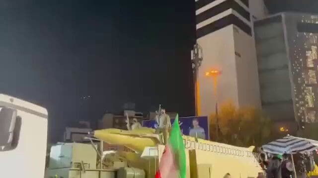 @Open Source Intel: Footage shows the IRGC transporting a Ghadr-110 ballistic missile and its launcher through Vanak Square tonight, presented as part of a “night march.”