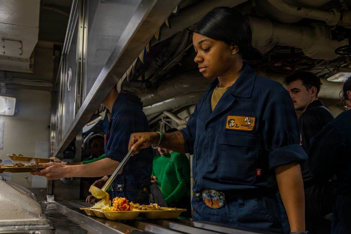 @U.S. Central Command: Sailors aboard aircraft carrier USS Abraham Lincoln (CVN 72) serve meals to crew members. A typical aircraft carrier strike group serves around 4,000 eggs daily.
Three aircraft carrier strike groups