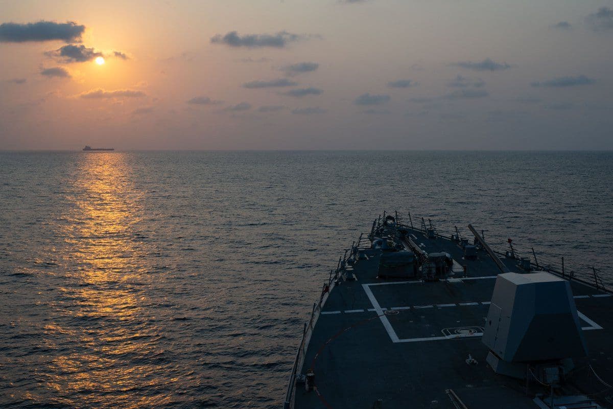 @U.S. Central Command: Guided-missile destroyer USS Pinckney (DDG 91) observes a merchant vessel while on patrol enforcing the U.S. blockade against Iran. As of today, 50 commercial vessels have been redirected by U.S. forc