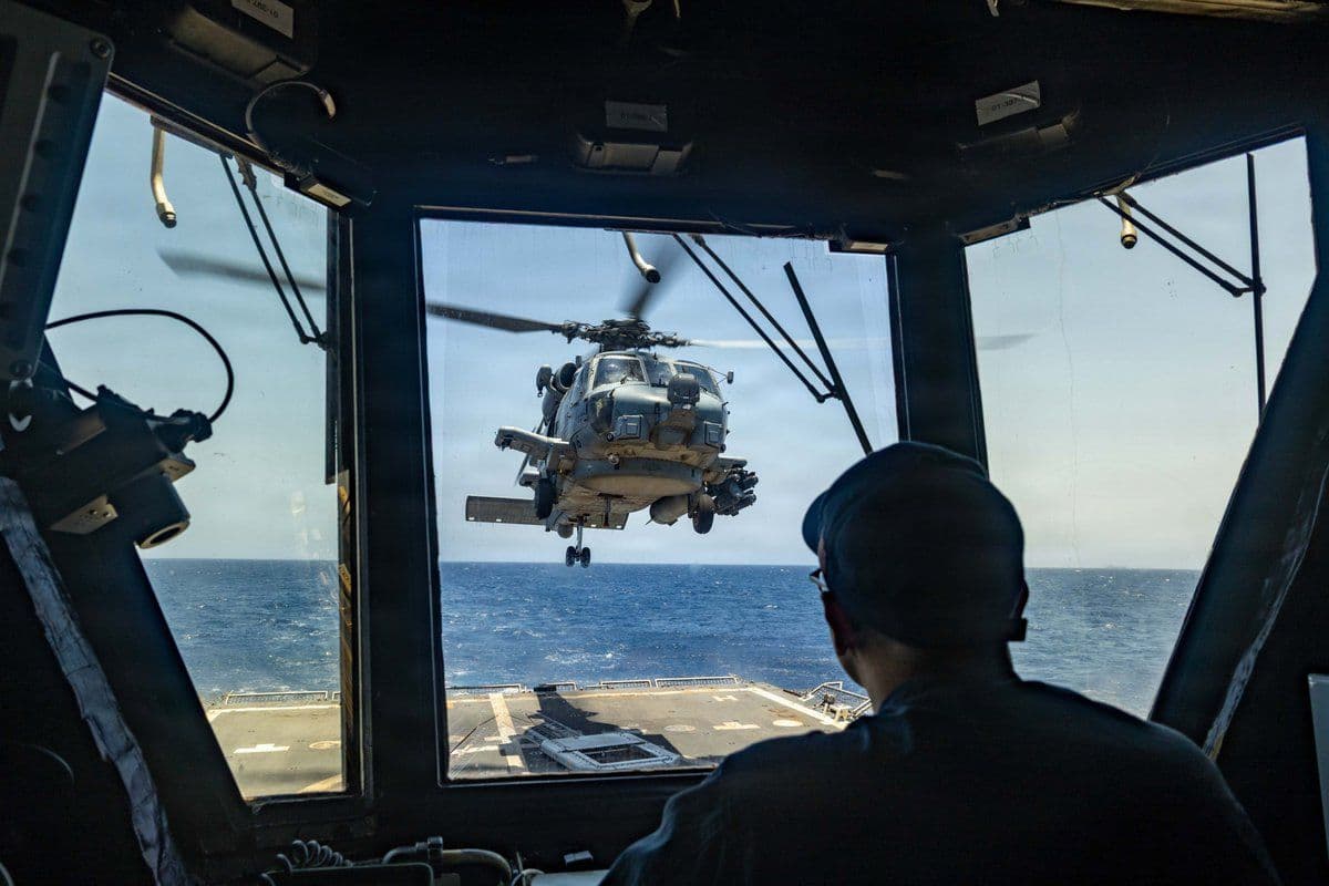 @U.S. Central Command: An MH-60R Sea Hawk takes off from the flight deck of USS Rafael Peralta (DDG 115) transiting the Arabian Sea as American forces enforce a maritime blockade against Iran. As of today, 75 commercial ves