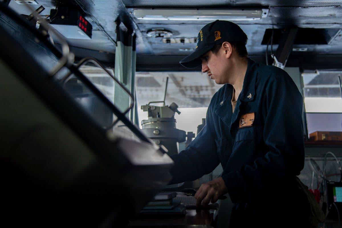 @U.S. Central Command: A U.S. Sailor stands watch aboard USS Abraham Lincoln (CVN 72) as the aircraft carrier transits the Arabian Sea, May 18. CENTCOM forces have redirected 88 commercial vessels, and disabled 4 to ensure
