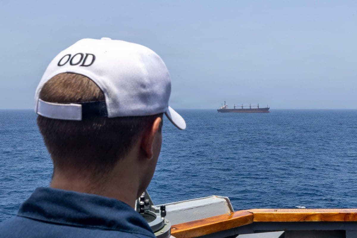 @U.S. Central Command: The officer of the deck aboard USS Michael Murphy (DDG 112) observes a merchant vessel while the guided-missile destroyer enforces the U.S. blockade against Iran in the Arabian Sea. As of June 7, CENT