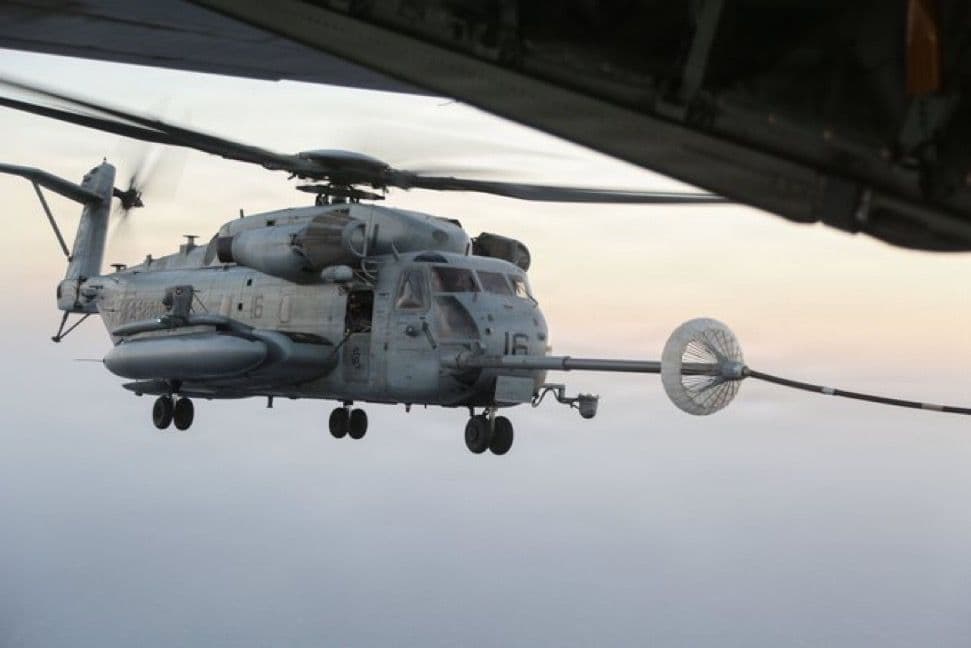 @Open Source Intel: U.S. Central Command (CENTCOM):
"A U.S. Marine Corps CH-53E helicopter is refueled by a KC-130J Super Hercules while flying over the Middle East. CH-53 helicopters refuel using a probe-and-drogue sys