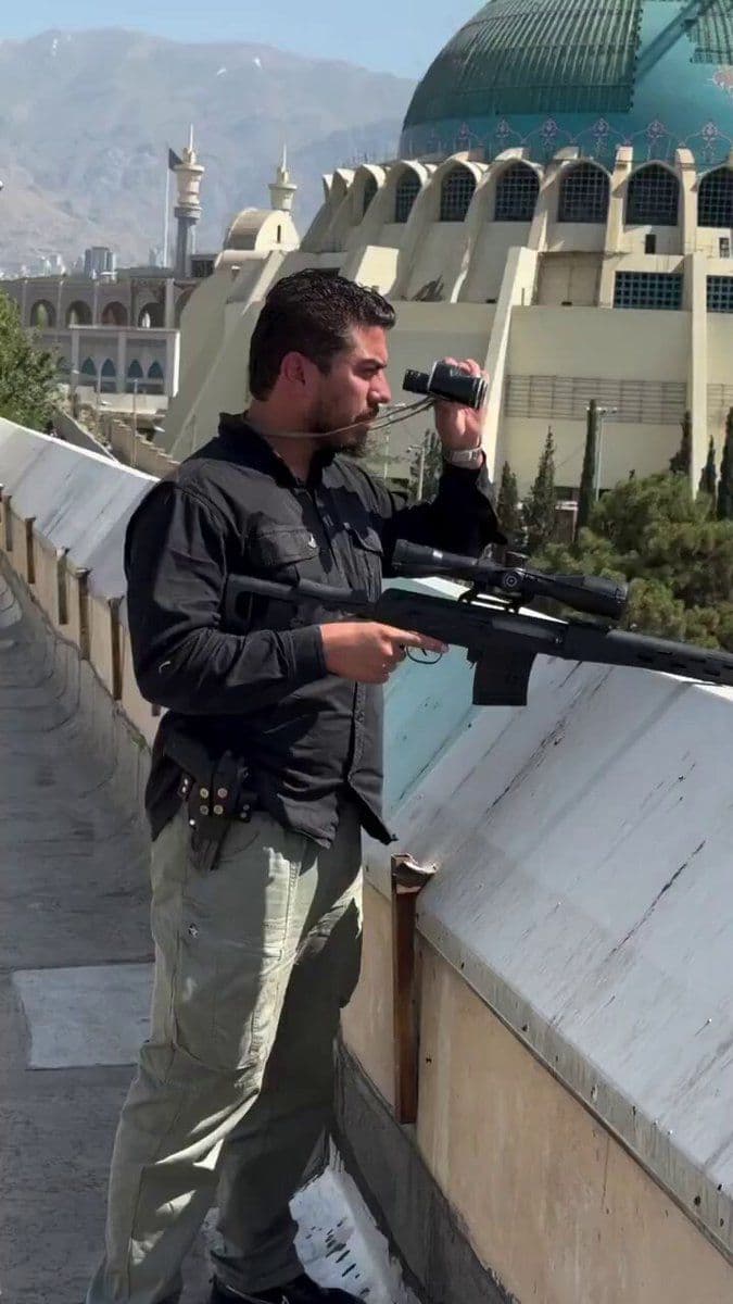 @Babak Taghvaee - The Crisis Watch: Video recorded in Tehran, the capital city of Iran today, shows Reza Gholami Aram, one of the snipers of the special police units of Iran’s Islamic regime protecting regime supporters during the funer